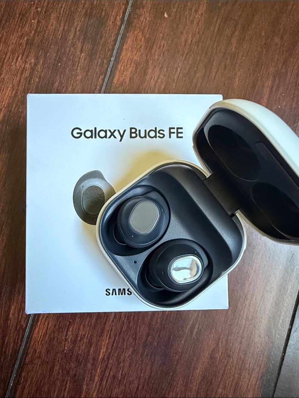 Samsung Galaxy Buds FE Earbuds in Black and White Charging Case